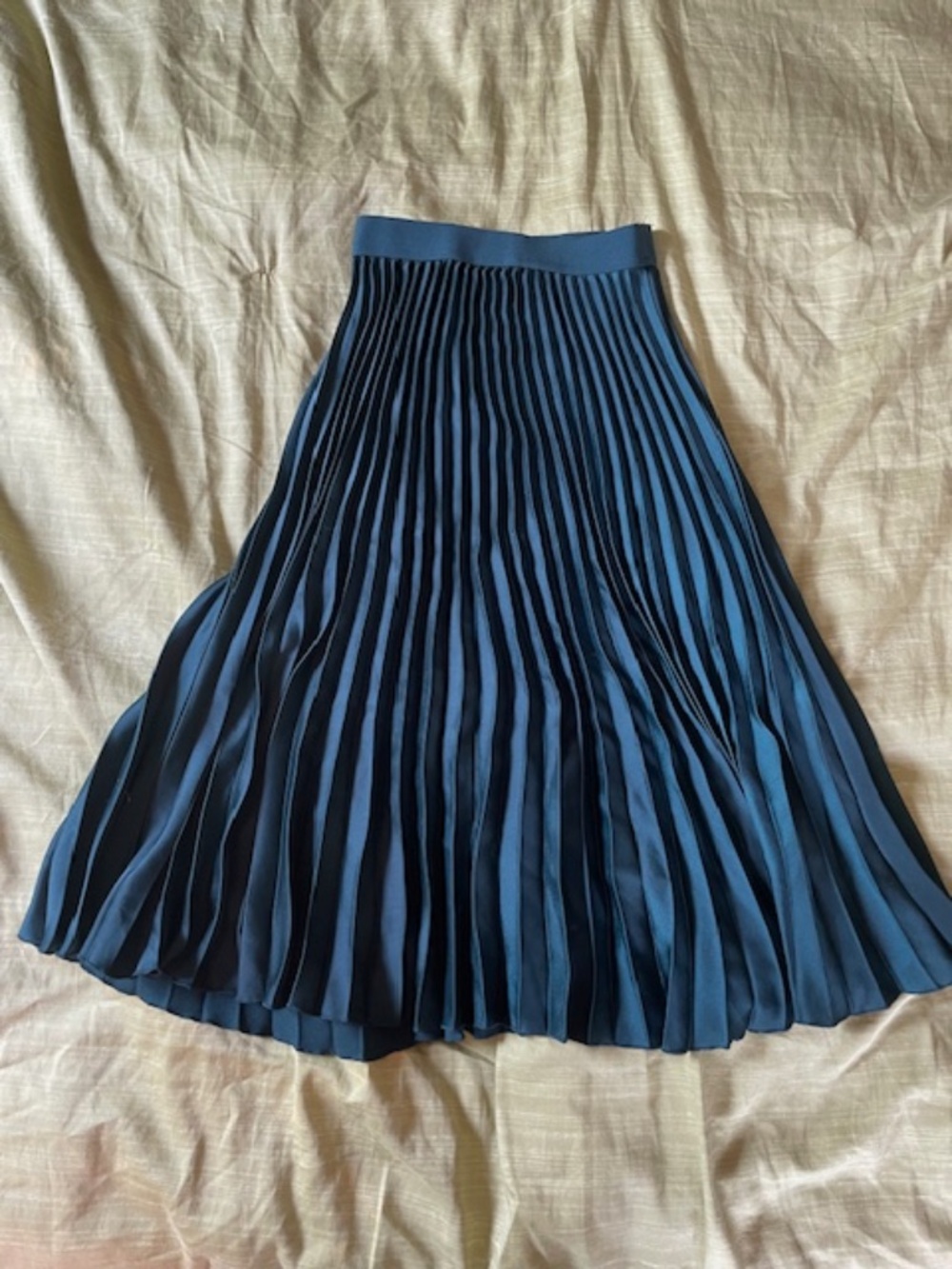 Green pleated midi skirt